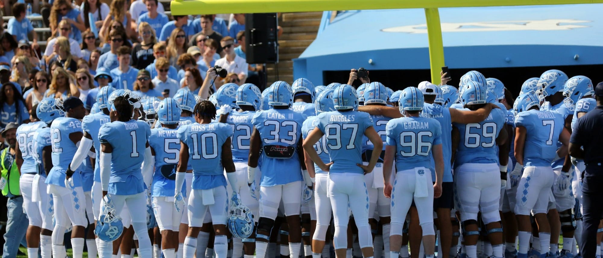 soccer players on field during daytime